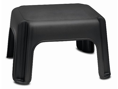 Black plastic step stool with a textured top surface and sturdy legs, designed for stability and easy access to higher areas.