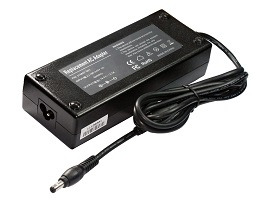 Black ASUS power adapter with a rectangular design, featuring a 65W capacity, a DC output connector, and labeled specifications on the top surface.