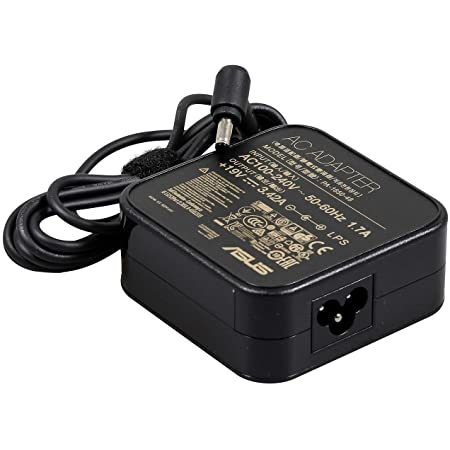 Black ASUS power adapter with a square design, featuring a labeled back, a round connector tip, and a flexible cable, rated at 65W for indoor use.