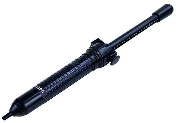 Black plastic desoldering pump with a textured grip, featuring a release button and a narrow nozzle for precise solder removal, marked with "ATTEN at-E330A."
