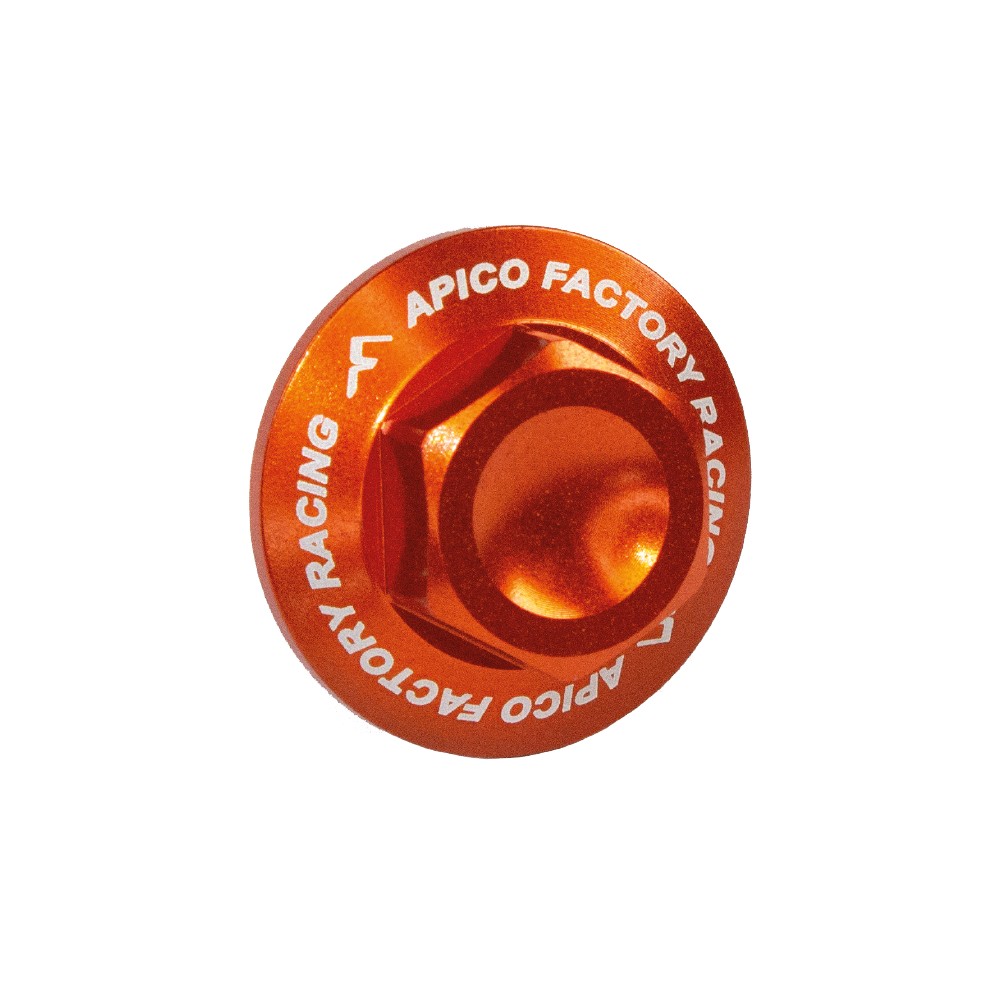 Bright orange aluminum axle nut with a rounded top and engraved "APICO FACTORY RACING" text, designed for KTM and Husqvarna models from 2015 to 2025.