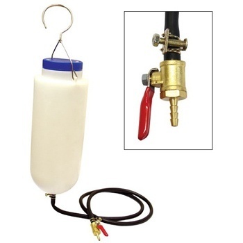 White plastic auxiliary fuel tank with a blue cap, featuring a black fuel line and a brass in-line petcock with a red lever for fuel control.