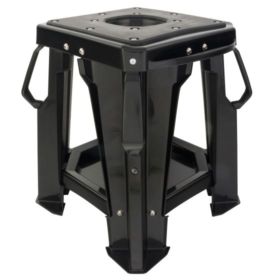 Black motocross bike stand with a sturdy plastic construction, featuring a square top, reinforced legs, and side handles for easy transport.