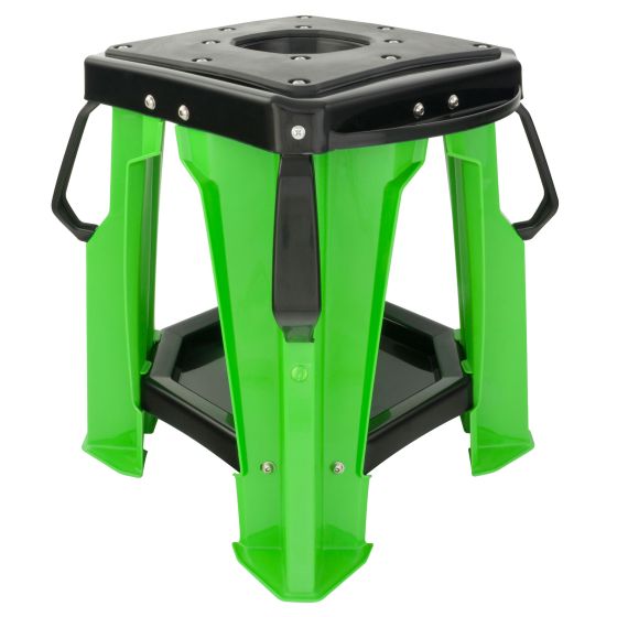 Green plastic motocross bike stand with a black top, featuring a hexagonal shape, sturdy legs, and handles for easy transport.