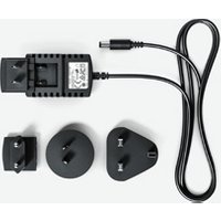 Black Blackmagic Design power adapter with three interchangeable plug heads and attached cable.
