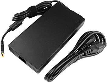Black power adapter/inverter with a rectangular design, featuring a cable with a connector and a bundled power cord, made of durable plastic material.