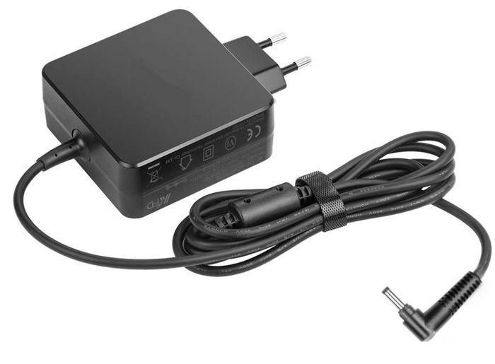 Black 65W power adapter/inverter with a compact design, featuring a two-prong plug and a coiled black cable with a cylindrical connector.