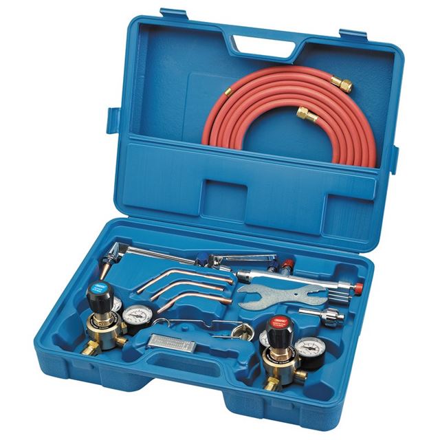 Draper 70155 Oxyacetylene welding and cutting set in a blue plastic case, featuring red hoses, brass regulators, and various metal tools arranged neatly inside.