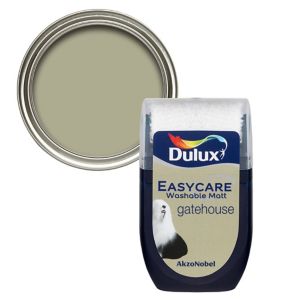 Dulux Easycare Gatehouse flat matt emulsion paint tester pot in 30ml, featuring a soft, muted green color with a white lid and a silver paint can lid behind it.