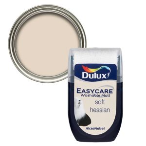 Dulux Easycare Soft Hessian flat matt emulsion paint tester pot in a 30ml size, featuring a beige color and a clear lid, with a metallic paint can behind it.