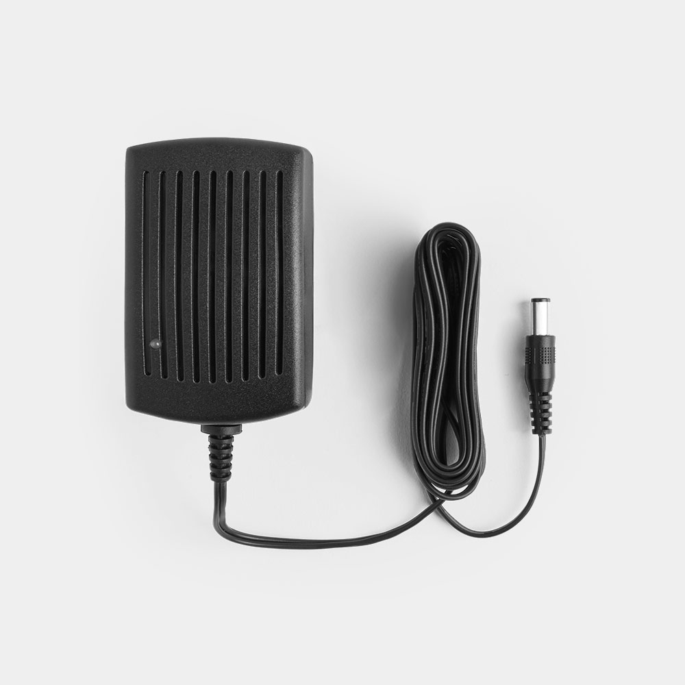 Black E-series Battery Charger by VonHaus with a textured surface, featuring ventilation slits and a long black cable ending in a cylindrical connector.