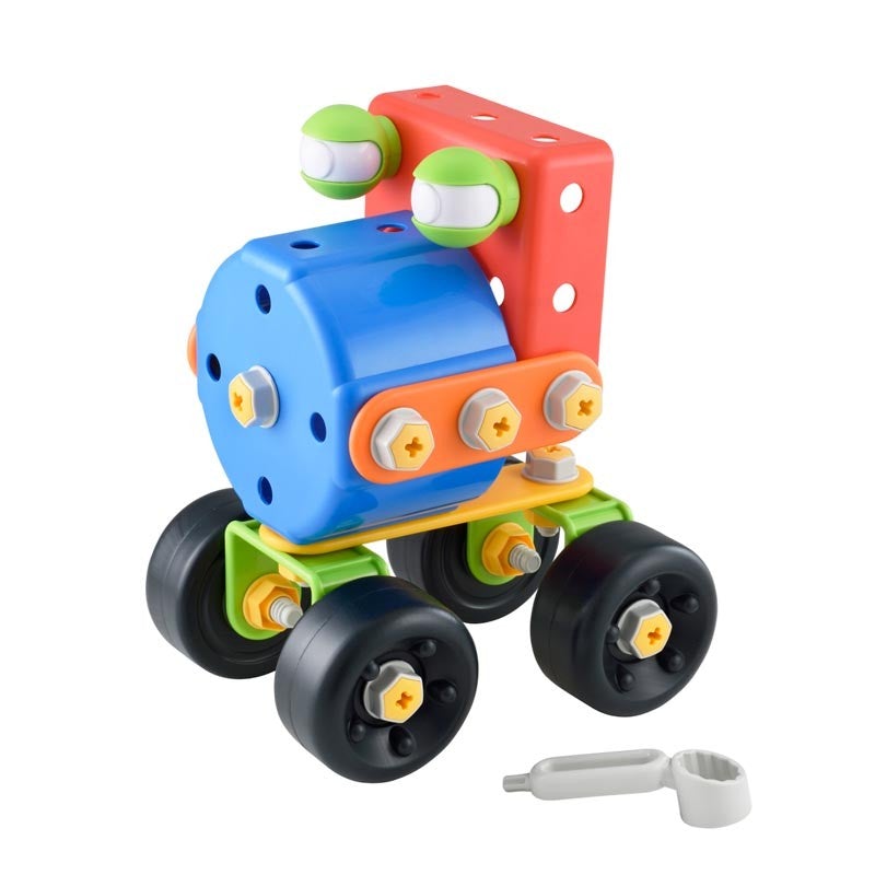 Colorful plastic construction set featuring a blue circular base, red and green connectors, and black wheels, with a small tool included for assembly.