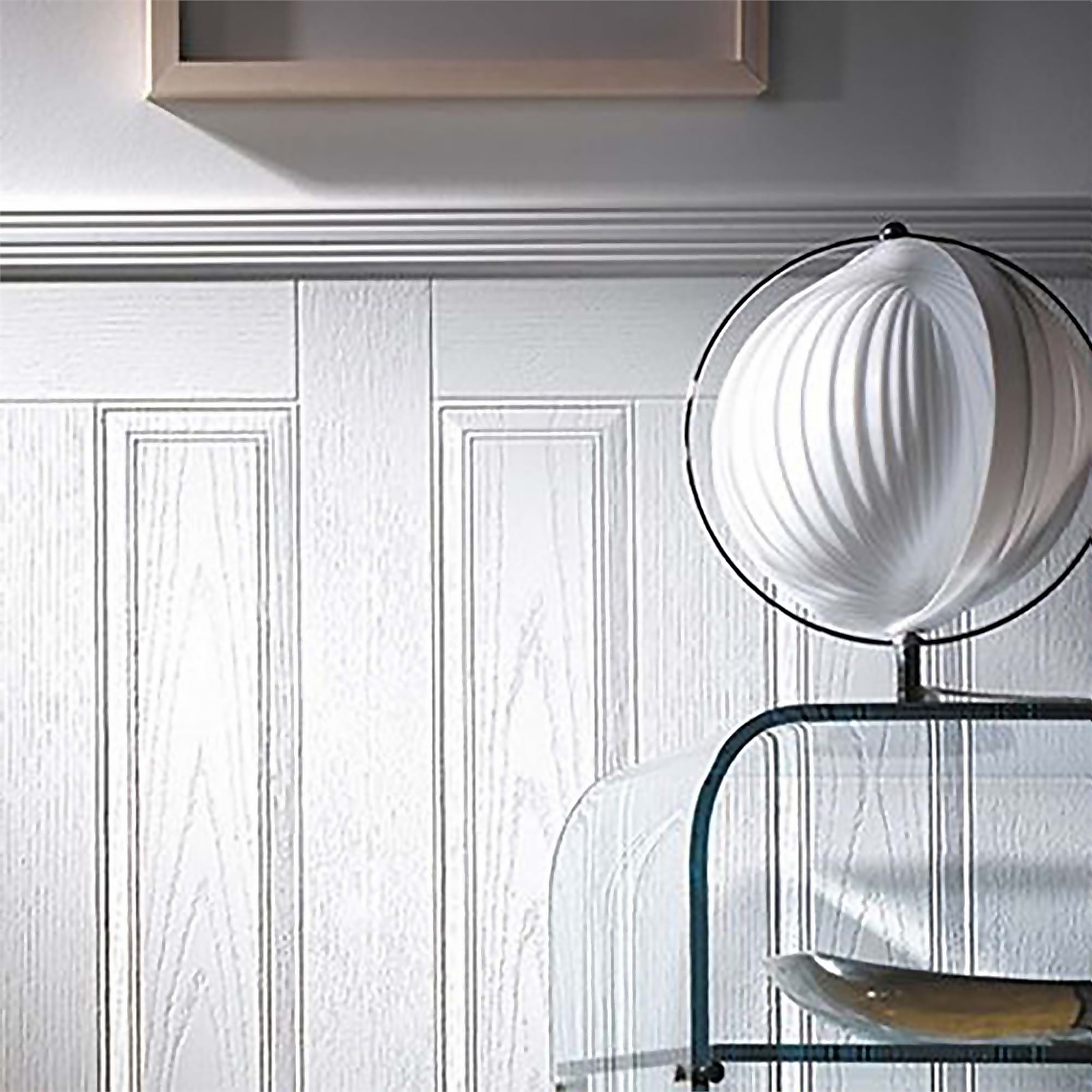 EASIpanel Raised and Fielded MDF wall panel in a light wood finish, featuring vertical grooves, measuring 915 x 516mm, displayed with a decorative lamp and glass shelf.