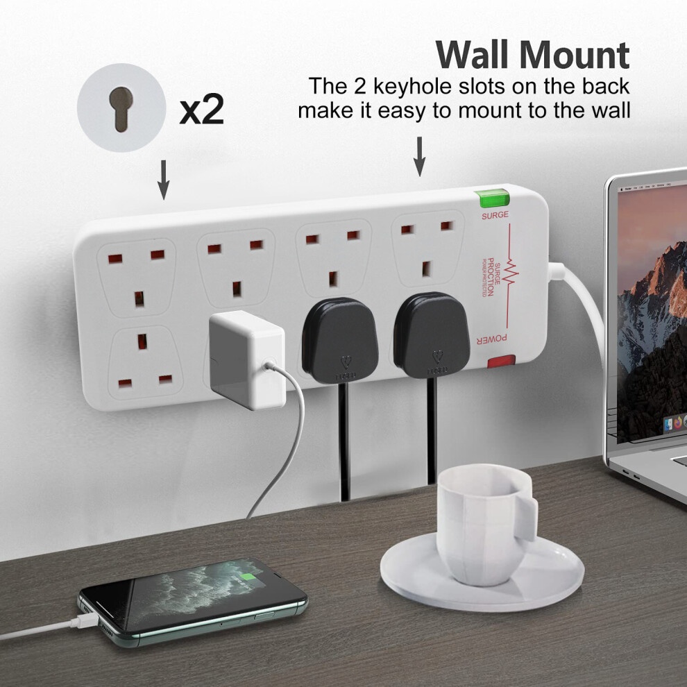 White 8-gang surge-protected extension lead with two keyhole slots for wall mounting, featuring a green surge indicator and two connected devices, placed on a wooden surface.