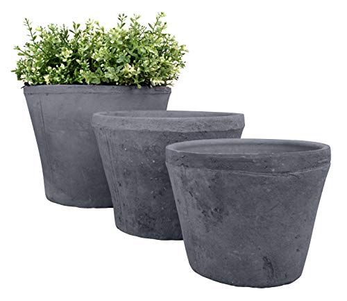 Set of three round flower pots in charcoal-colored aged terracotta, featuring a textured finish and varying sizes, with a small green plant in the largest pot.