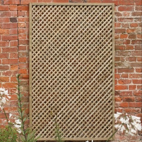 5'11" x 2'11" wooden lattice panel in a diamond pattern, featuring a natural wood finish, set against a rustic brick wall with white flowers in the foreground.
