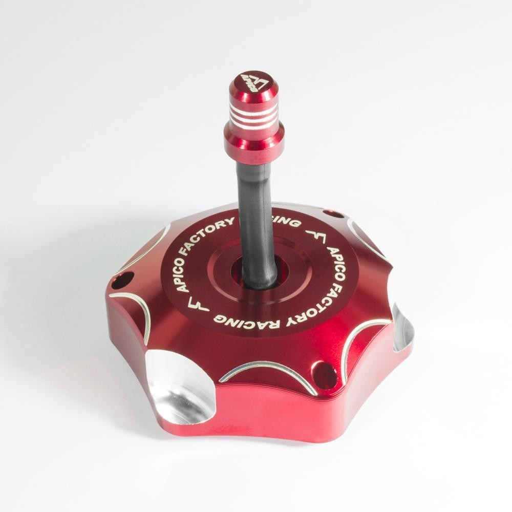 Red alloy fuel cap with a star-shaped design, featuring a black center post and silver accents, designed for various Suzuki motorcycle models from 2001 to 2022.