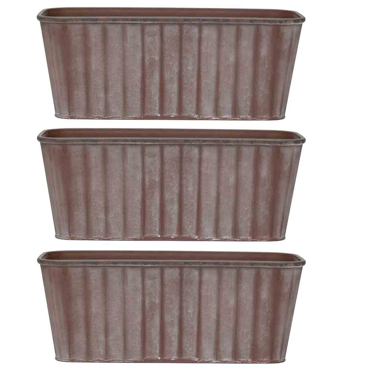 Three rust-colored metal effect trough planters with ribbed sides, each measuring 38 cm in length, ideal for gardening or decorative use.