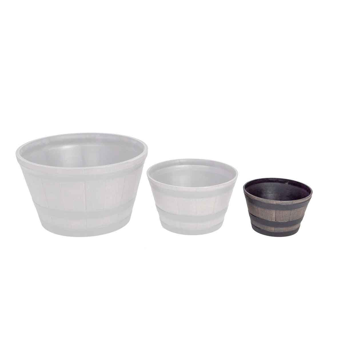 Small planter set featuring three wooden barrel effect pots in brown, with a smooth finish and varying sizes, ideal for garden or indoor use.
