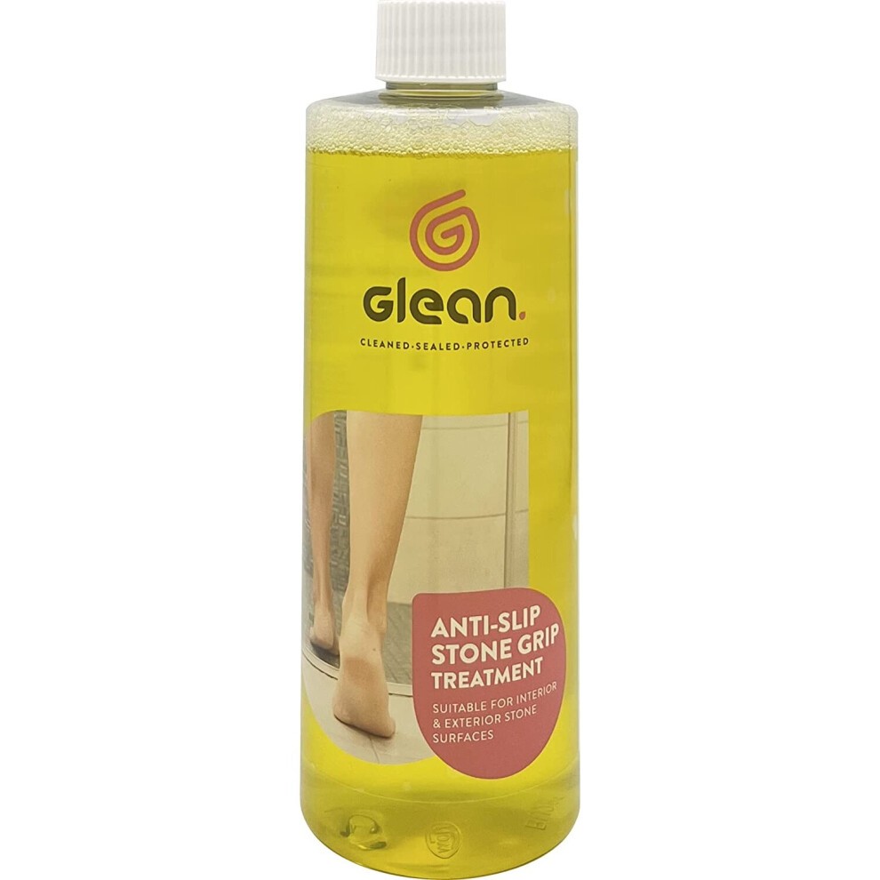 Transparent bottle of GLEAN Anti-Slip Stone Grip Treatment, 500ml, with a yellow liquid, featuring a red label and a logo, designed to increase traction on slippery stone surfaces.