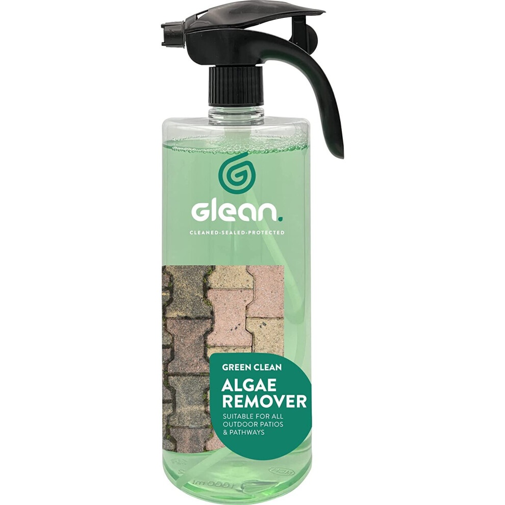 Clear spray bottle with a black trigger nozzle, filled with green liquid, labeled "GLEAN Green Clean Algae Remover," featuring a before-and-after image of brick pathways.
