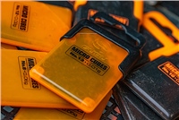 Bright orange plastic container labeled "MICRO CUBES" with black accents, designed for size 11 refill, surrounded by additional cubes in various colors.