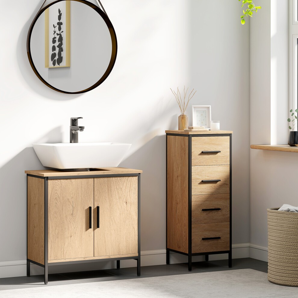 Light oak under sink cabinet with two doors, black metal frame, paired with a tall drawer unit, modern basin sink, and round mirror in a bright, minimalist bathroom setting.