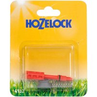 Red Hozelock pressure release assembly in clear plastic packaging on yellow and green background.