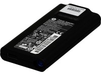 Black HP 693716-001 power adapter with a textured surface, featuring a label with technical specifications and a blue LED indicator.