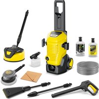 Yellow Karcher pressure washer with black accents, hose, nozzles, detergent bottles, and cleaning attachments.