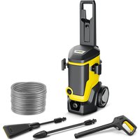 Yellow and black Karcher pressure washer with hose, spray gun, and two nozzles, featuring large wheels and upright design.
