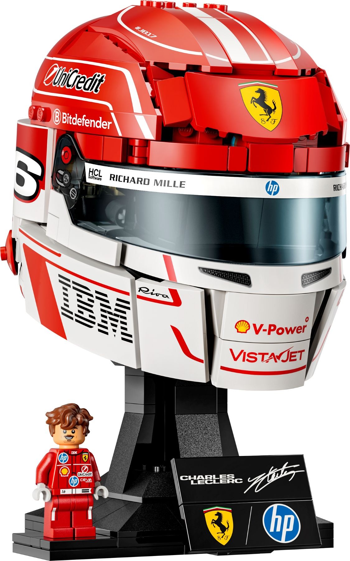 Red and white LEGO helmet model representing Charles Leclerc's Scuderia Ferrari design, featuring sponsor logos, a minifigure in racing attire, and a display stand with a signature.