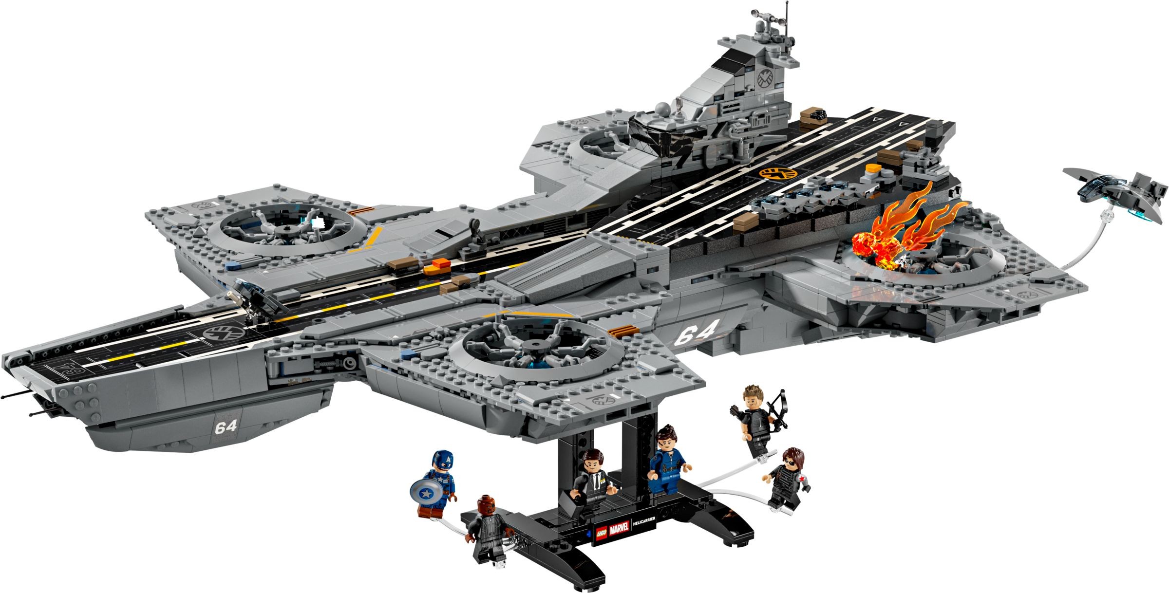 Detailed model of the S.H.I.E.L.D. Helicarrier in gray, featuring a black runway, rotating turrets, and mini-figures of superheroes like Captain America and Black Widow.