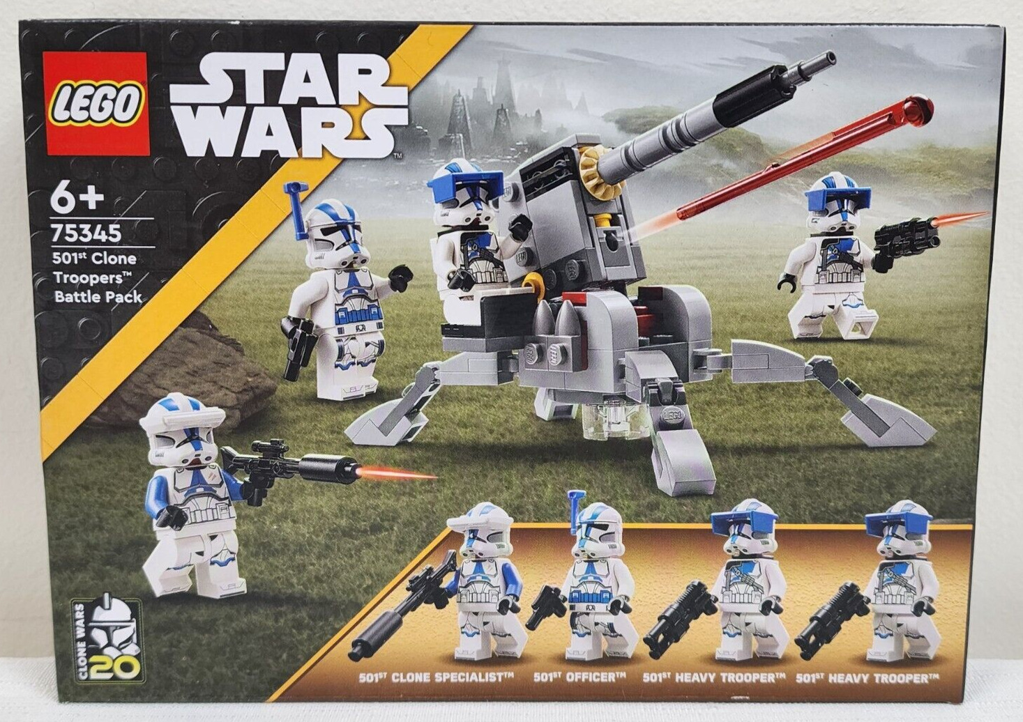 501st Clone Troopers Battle Pack features six LEGO figures in blue and white armor, a gray cannon with a red laser, and various weapons, all set against a Star Wars-themed backdrop.