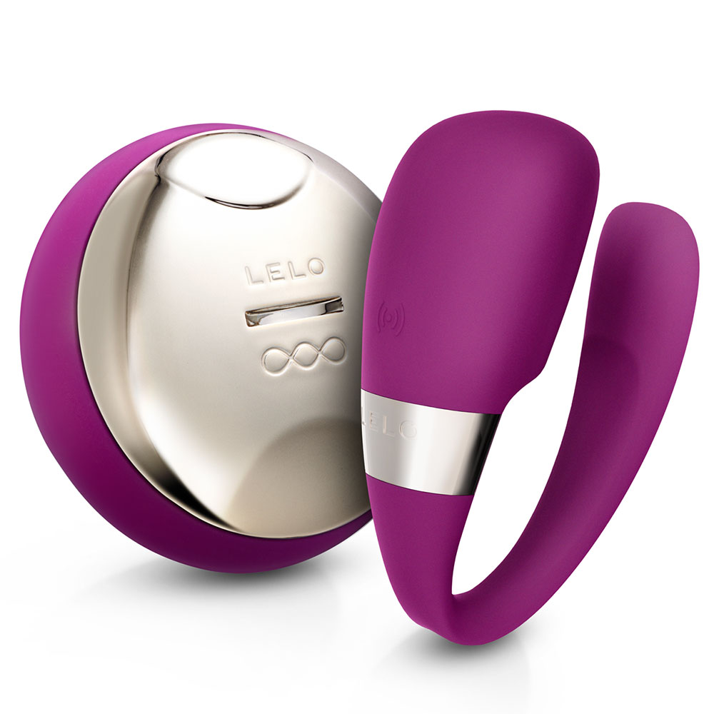 Deep rose silicone couples' massager with a sleek design, featuring a shiny silver button and a remote control, ideal for shared pleasure.