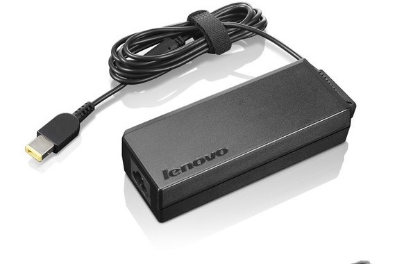 Black Lenovo 0A36265 power adapter with a 65W output, featuring a textured surface, a coiled cable, and a yellow connector tip.
