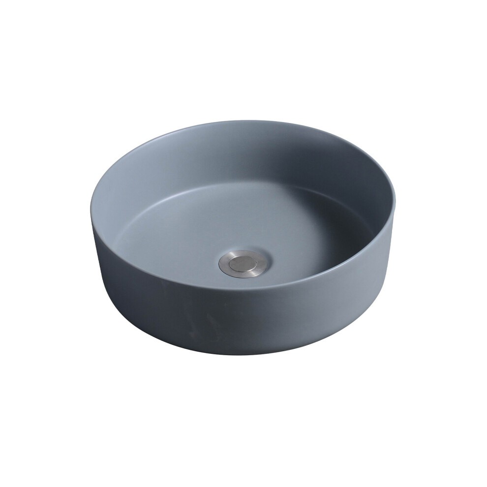 Dark grey ceramic round countertop basin with a smooth finish and a central drain hole, featuring a minimalist design ideal for modern bathrooms.