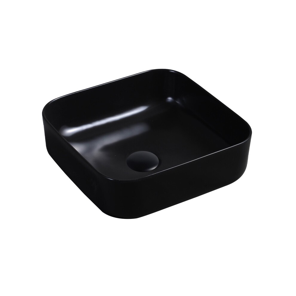 Matte black ceramic square countertop basin with rounded edges and a central drain hole, showcasing a sleek and modern design.