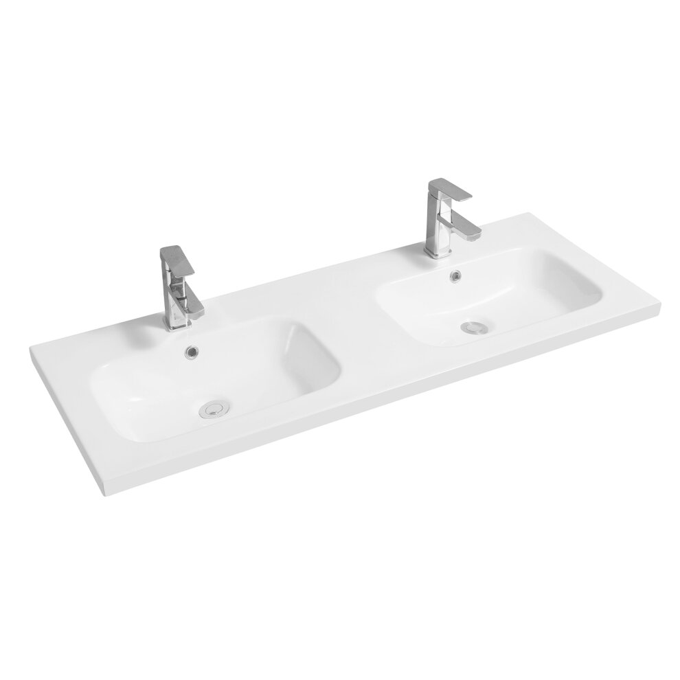 White ceramic inset basin with a double oval design, featuring mid-edge styling and sleek chrome faucets, set on a flat surface.
