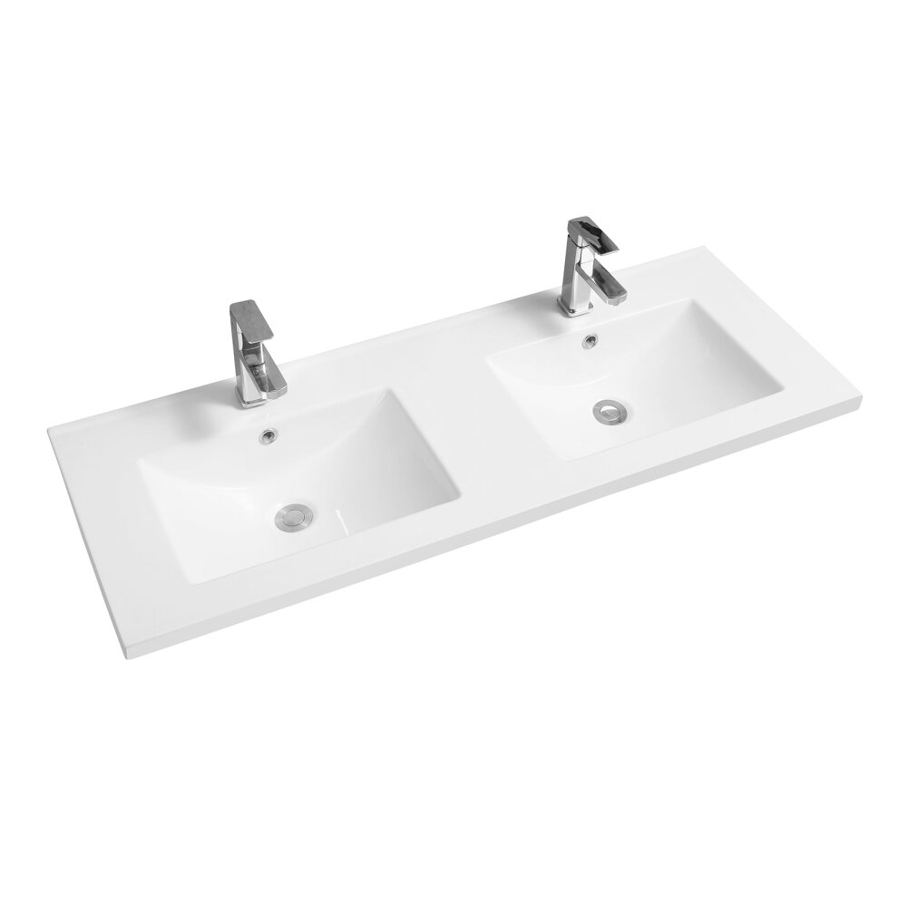 White ceramic inset basin with a mid-edge design, featuring two scooped sinks and sleek chrome faucets, set on a smooth rectangular countertop.