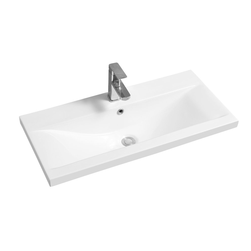 White ceramic 81cm narrow inset basin with a dipped bowl design and a sleek chrome faucet, featuring a central drain and smooth, modern lines.