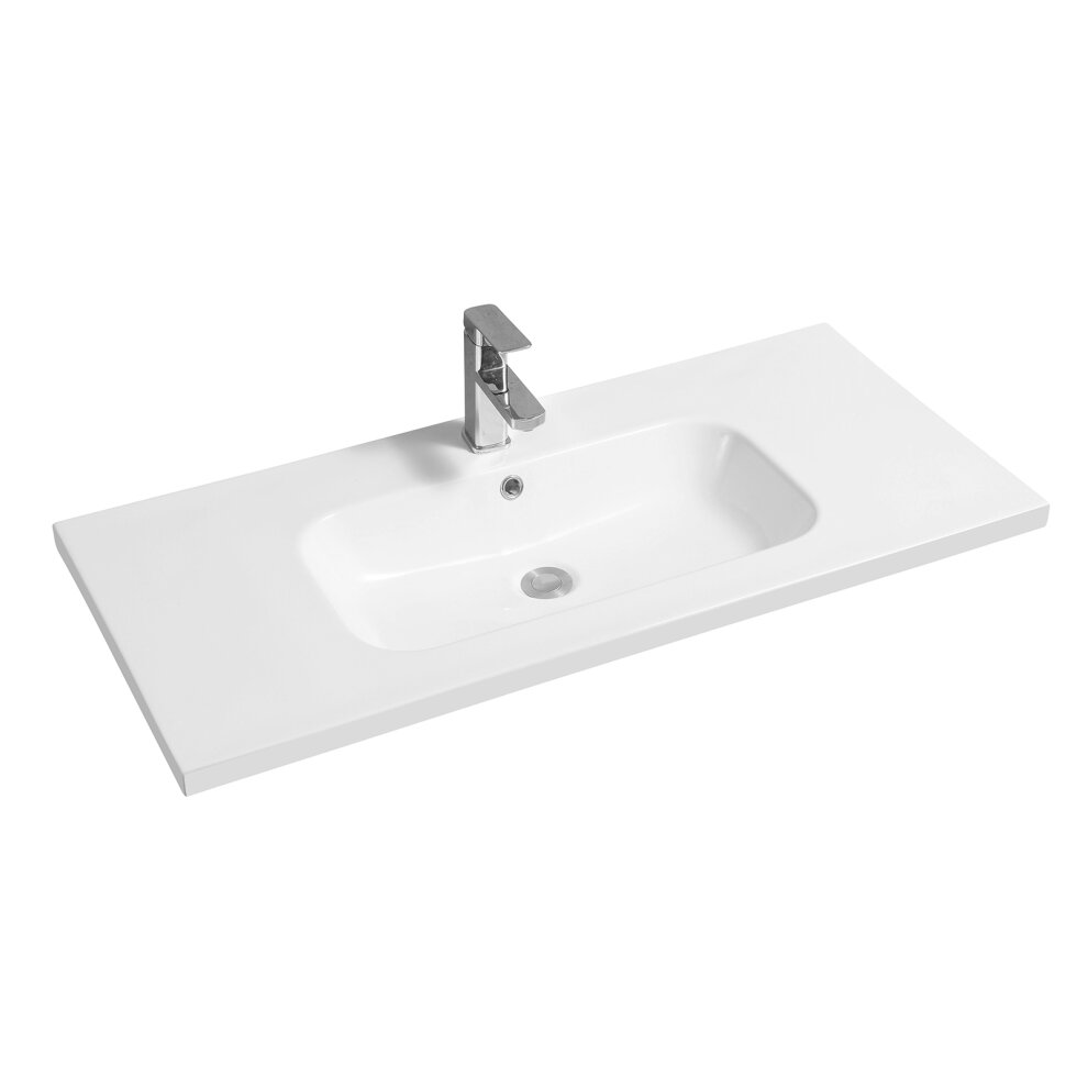 White ceramic inset basin with an oval shape and mid-edge design, featuring a sleek chrome faucet and a rectangular countertop.