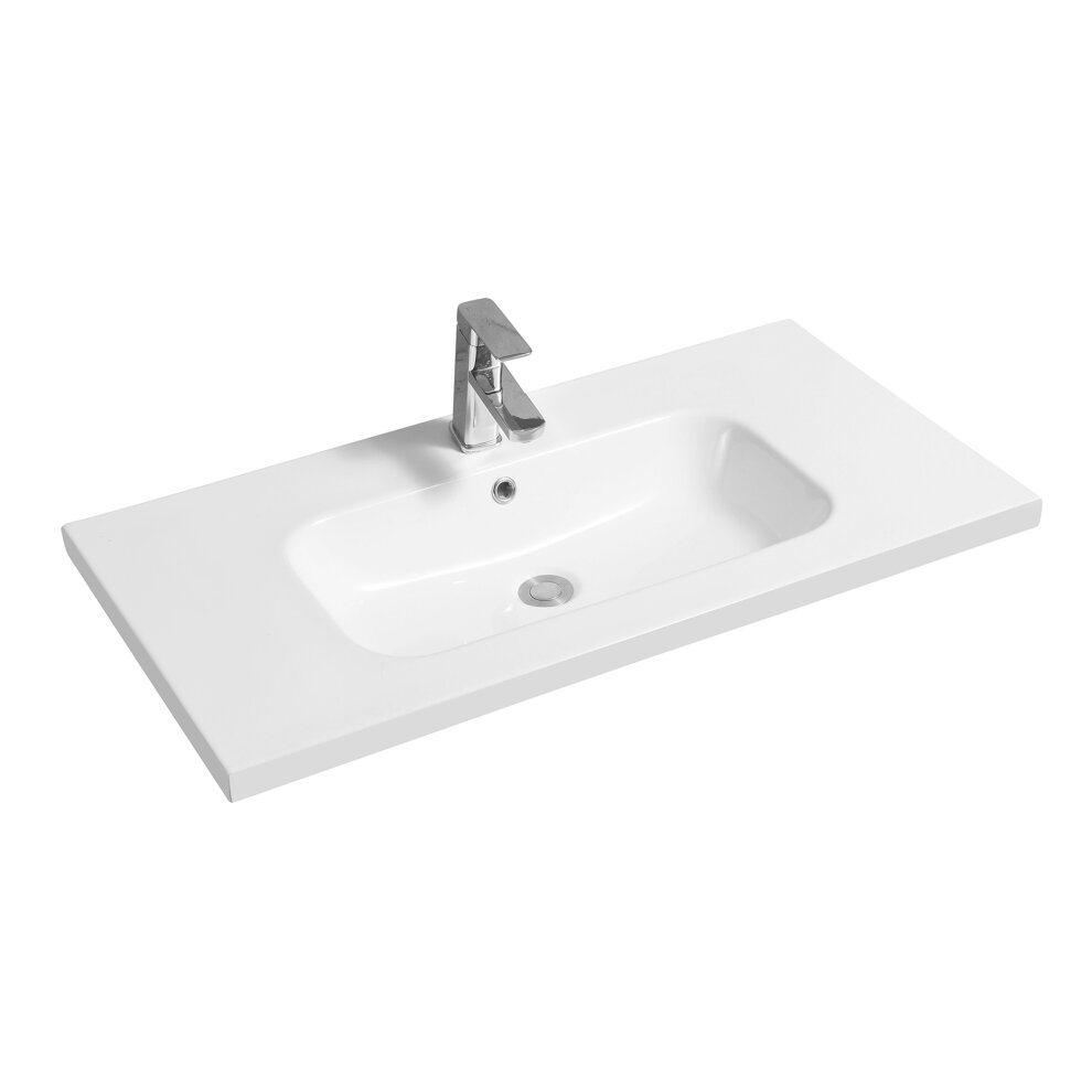 White ceramic inset basin with an oval shape, mid-edge design, featuring a sleek chrome faucet and a spacious rectangular countertop.