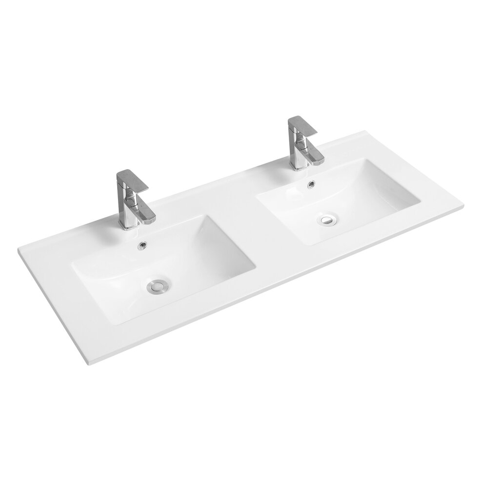 White ceramic double inset basin with a scooped design and thin edges, featuring two chrome faucets and a sleek, modern aesthetic.