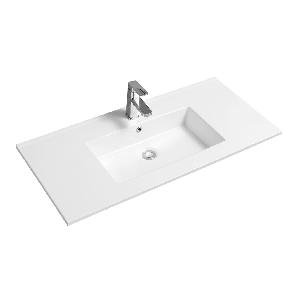 Rectangular white ceramic inset basin with a thin edge, featuring a central sink and a sleek chrome faucet, designed for modern bathrooms.