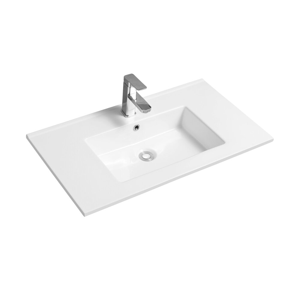 Rectangular white ceramic inset basin with a thin edge, featuring a central drain and sleek chrome faucet, showcasing a modern and minimalist design.