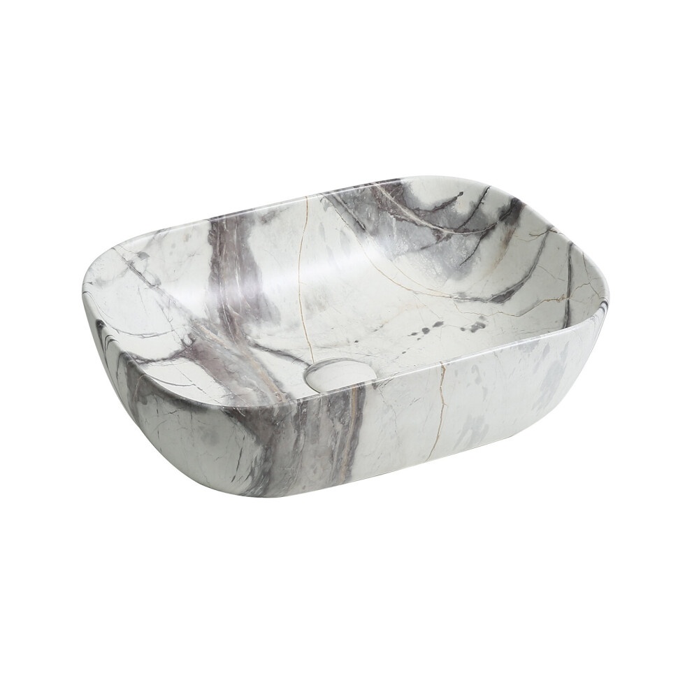 Ceramic oblong countertop basin in white marble effect featuring gray veining, smooth rounded edges, and a central drain hole, ideal for modern bathroom designs.