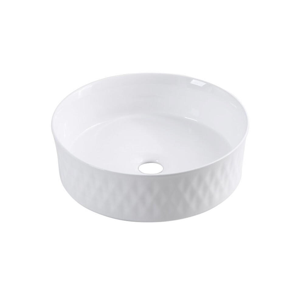 Round ceramic countertop basin in glossy white with textured diamond patterns, featuring a central drain hole.