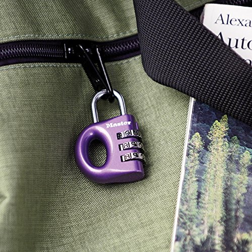 Purple zinc combination padlock with a rounded body, featuring a three-digit rotating dial, attached to a green fabric bag, securing a book.