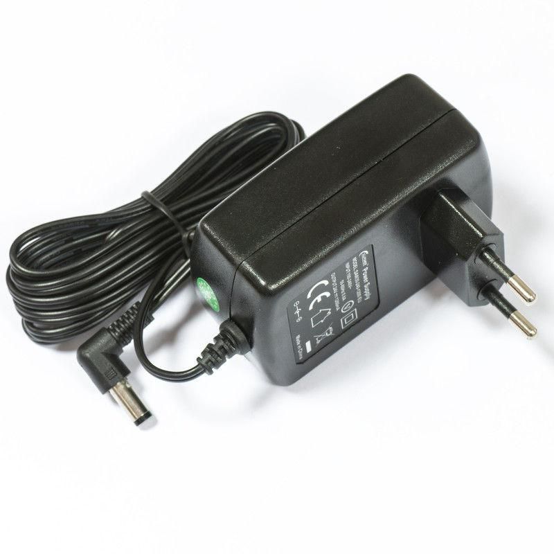 Black Mikrotik power adapter with a rectangular body, two prongs, a coiled cable, and a barrel connector, featuring safety certifications on the side.